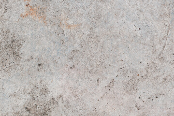 Top-down view of the dirty concrete flooring surface as background