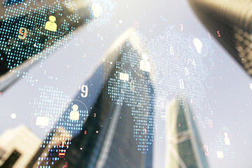 Virtual social network hologram and world map on office buildings background. Multiexposure