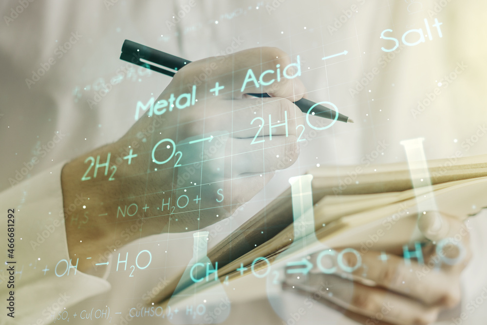 Wall mural creative chemistry hologram with man hand writing in notepad on background, pharmaceutical research 