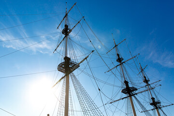 Rigging of a sailing ship against the blue sky.