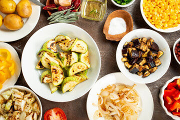 Vegetables in plates. baked and fried vegetables. Selective focus.