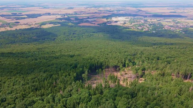 Drone flight over mountain village with forests. Sleza mountain near Wroclaw in Poland. Nature background, aerial view