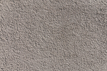 Gray concrete wall texture and background. Gray cement, grit, plaster. Corrugated, rough surface.