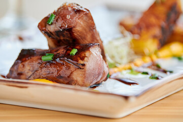 Tasty BBQ pork on plate