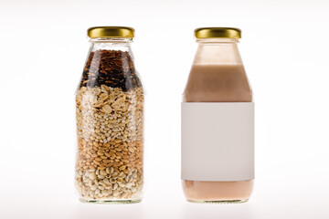 Luxury glass bottles of dry organic cereal and extract milk as nourishment drink for health therapy