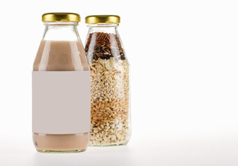 Cereal extract milk and dry organic compound grains in glass bottle for nourishment drink at breakfast for vegetarian and health therapy