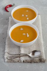two plates of pumpkin soup