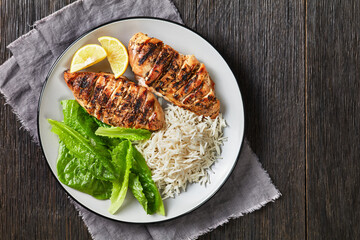 seared chicken breasts with lettuce and rice