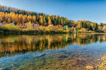 A picturesque view from the bank of the Sylva River on a bright autumn day.