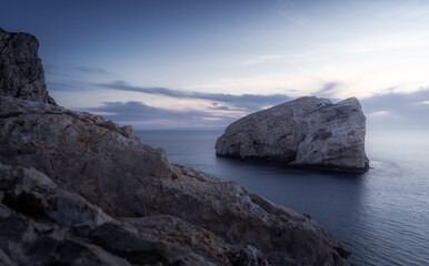 Blue hour at a rocky coast in Sardinia, Italy in summer