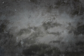 Beautiful gray texture with dark spots. Brush marks on wall.  From dark to light - vignette
