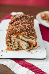 chocolate cake babka on a plate rose color