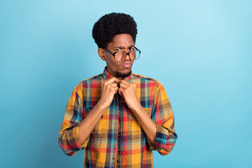 Photo of nerd millennial brunet guy wear checkered shirt isolated on blue color background