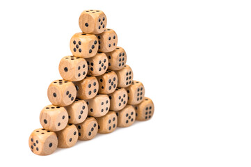 wooden playing cubes lying in the form of a pyramid on a white isolated background