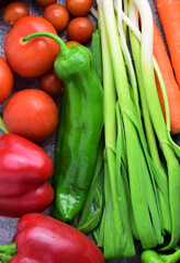 Vegetable and various products on stone background.	