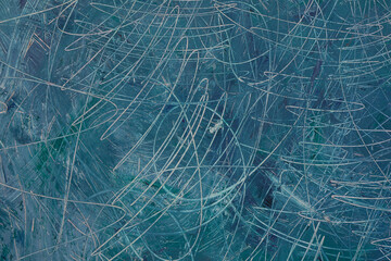 Fondo materico graffito in superficie e dipinto a tempera di colore verde-azzurro e blu; spazio per testo