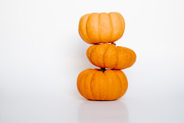 three small pumpkins