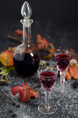 blackberry wine in crystal glasses and decanter