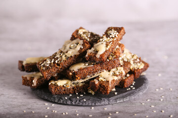 black bread croutons with cheese and garlic