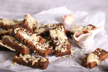 black bread croutons with cheese and garlic