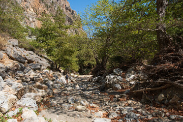rocky bottom of a canyon into the mountains of Crete at summer
