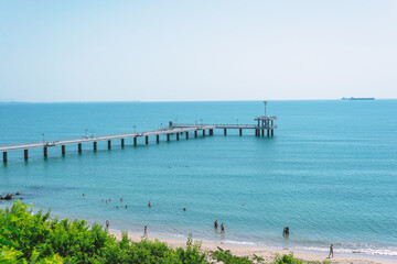 Fototapeta na wymiar Beach, coast in Bulgaria. View of the sea and pier on a sunny day.