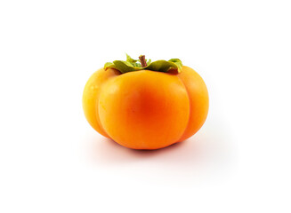 Photo of a ripe fuyu Asian persimmon with leaves and stem intact