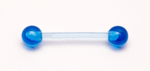 A set of jewelry for piercing on a white background. A set of earrings for the body, nose, navel, tongue, nipples, ears, various beauty jewelry, a set of cosmetological jewelry for piercing.