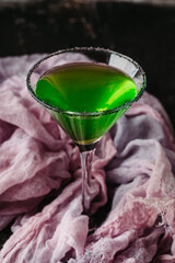 Green martini cocktail for halloween party. Selective focus. Shallow depth of field.