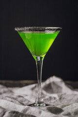 Green martini cocktail for halloween party. Selective focus. Shallow depth of field.