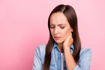Fototapeta premium Photo of sad mature lady feel sick wear jeans shirt isolated over pink color background