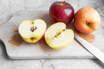 Naklejka na ściany i meble Red apples on a gray background. healthy eating