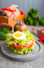 salmon and avocado and cucumber. salad on plate