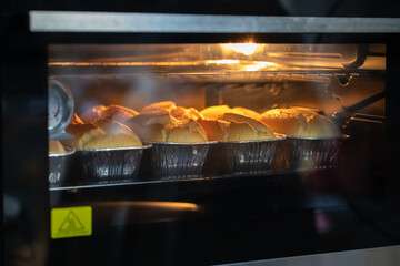 Freshly chiffon cake on baking trays in the oven. homemade bake,Selective focus