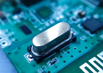 Close up image of crystal oscillator or electronic oscillator circuit. Electronic component.