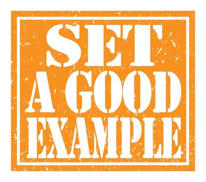 SET A GOOD EXAMPLE, Text Written On Orange Stamp Sign