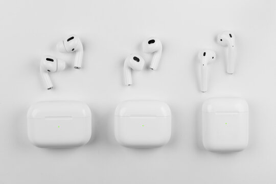 white wireless headphones on background