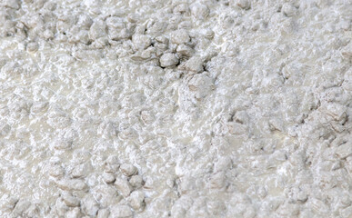 Concrete mix at a construction site as a background.