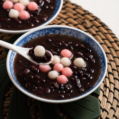 Red and white tangyuan with red bean soup.