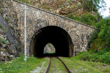 Fototapeta na wymiar Circum-Baikal Railway. Old railroad tunnel number 29 on the railway. tunnel Sharyzhalgay-2