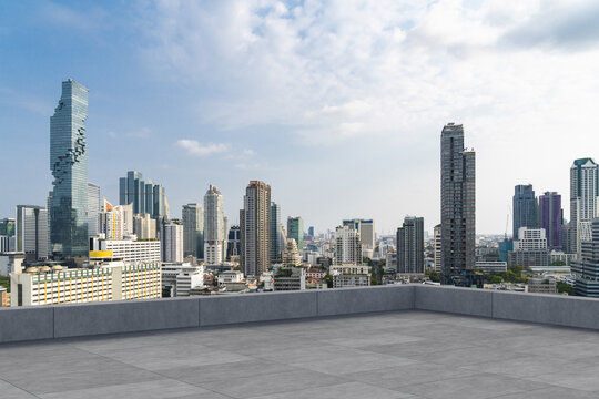 Panoramic Bangkok skyline view, concrete observatory deck on rooftop, daytime. Luxury Asian corporate and residential lifestyle. Financial city downtown, real estate. Product display mockup empty roof