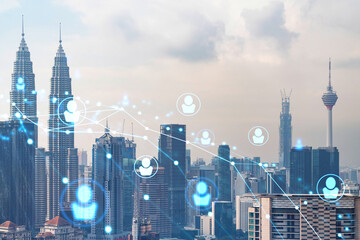 Social media icons hologram over panorama city view of Kuala Lumpur, Malaysia, Asia. The concept of...