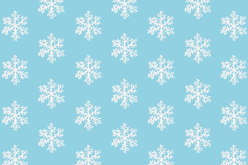 White snowflakes on a blue background. Christmas or New Year pattern. Winter decor element. Place for your text.