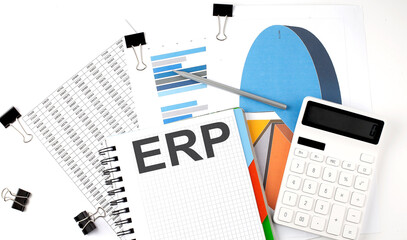 Text ERP on a notebook on the diagram and charts with calculator and pen