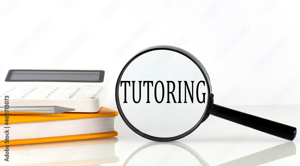 Poster magnifier with text tutoring with notebook, calculator on white background