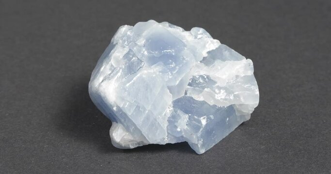 Calcite blue close-up on dark background. Rotation.