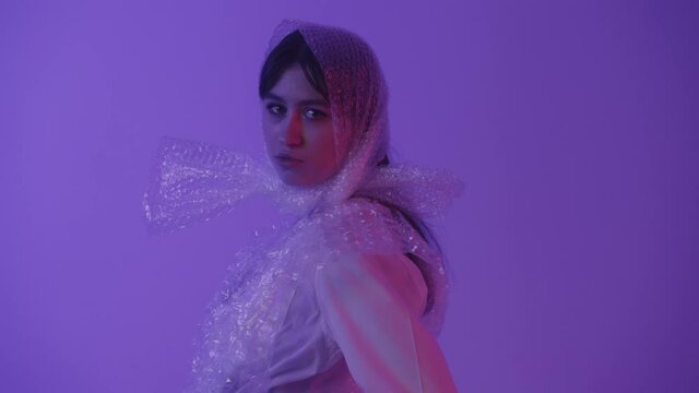 The girl was wrapped in plastic to protect the planet from pollution.