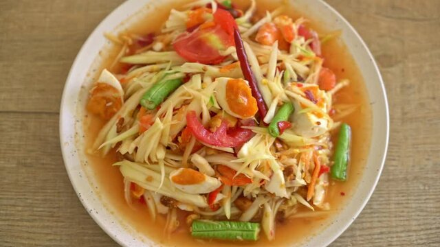 Som Tum - Thai Spicy green papaya salad with salty eggs - Asian food style