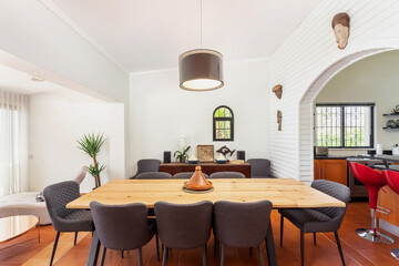 Traditional modern Mediterranean dining room, stylish decor with table and chairs. Overlooking the kitchen.