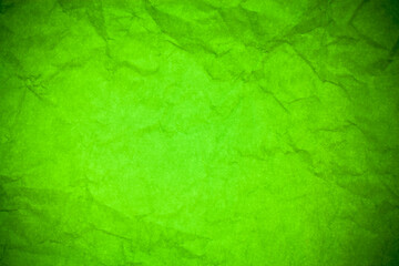 Green paper crumpled texture background.